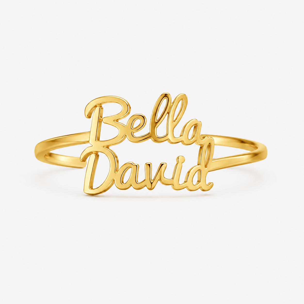 A gold-plated name ring featuring the script names 'Bella' and 'David' on a clean white background.at at shine gold and diamonds